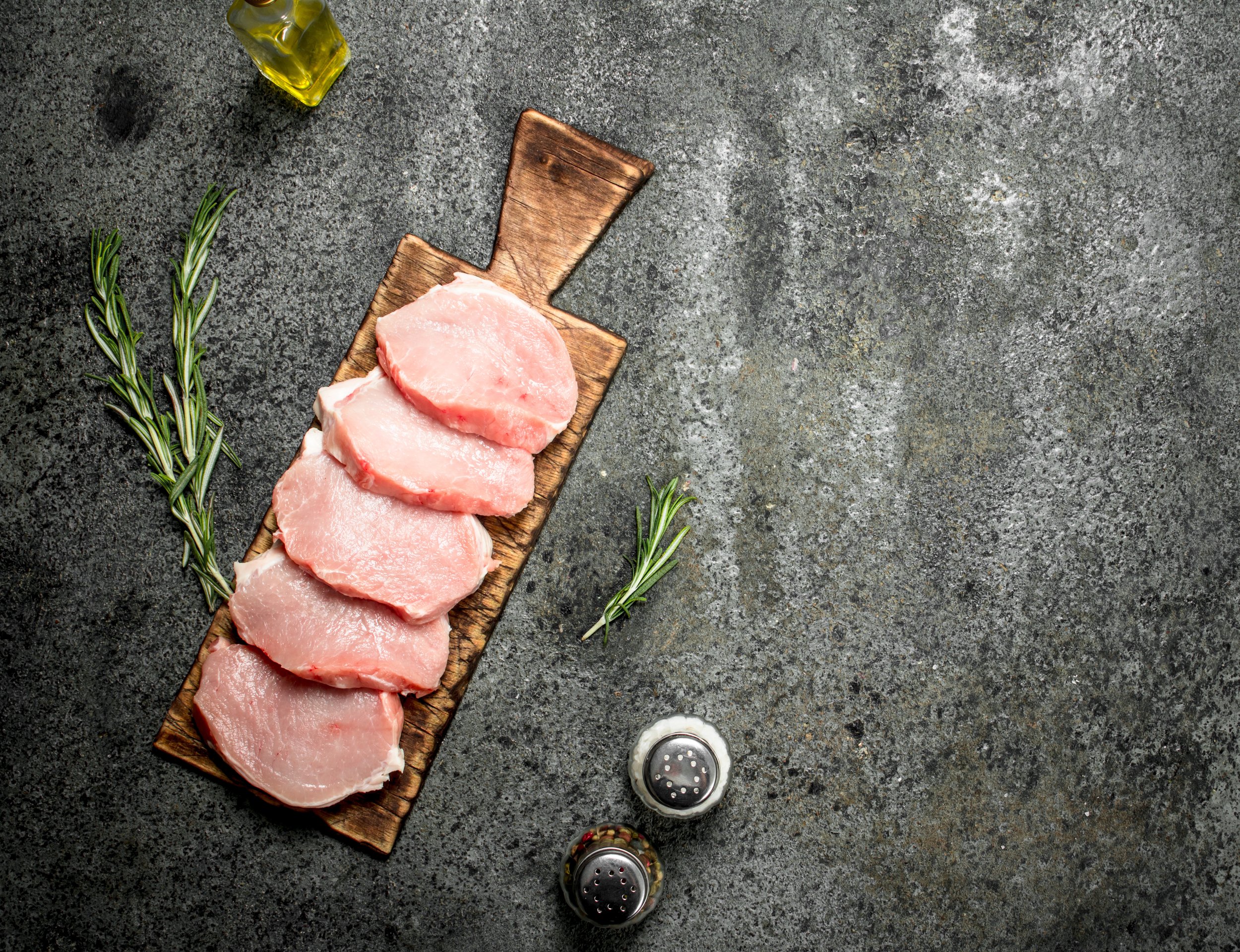 Raw pork steaks with herbs and spices. Image placeholder indicating a photo is needed, typically used in web design or content management systems to signal missing visual content.